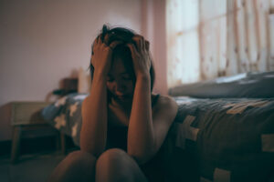 depressed woman holding head