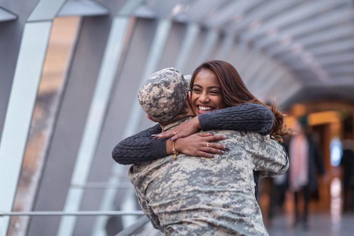 woman hugging her military husband