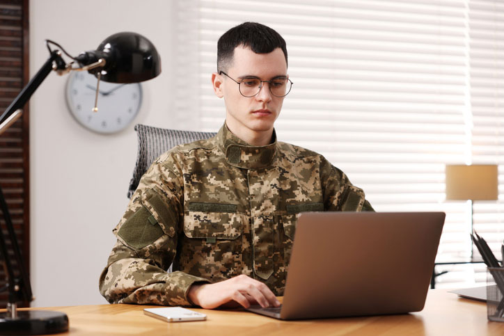 soldier working on laptop